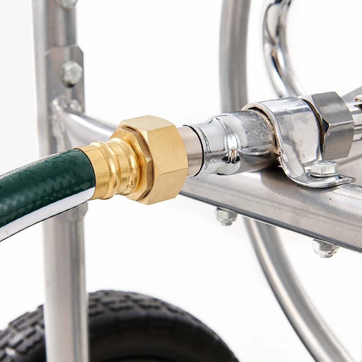 Brass hose connector and metal fitting on water hose reel cart with green hose end
