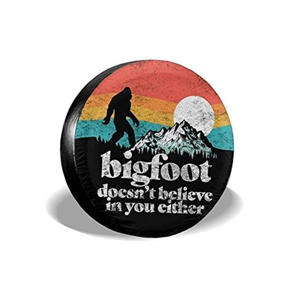 Black round RV spare tire cover with Bigfoot graphic and moon backdrop