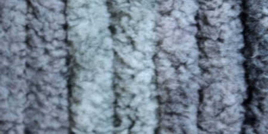 Thick textured yarn fabric close-up in cool gray-blue, soft chenille-style loops