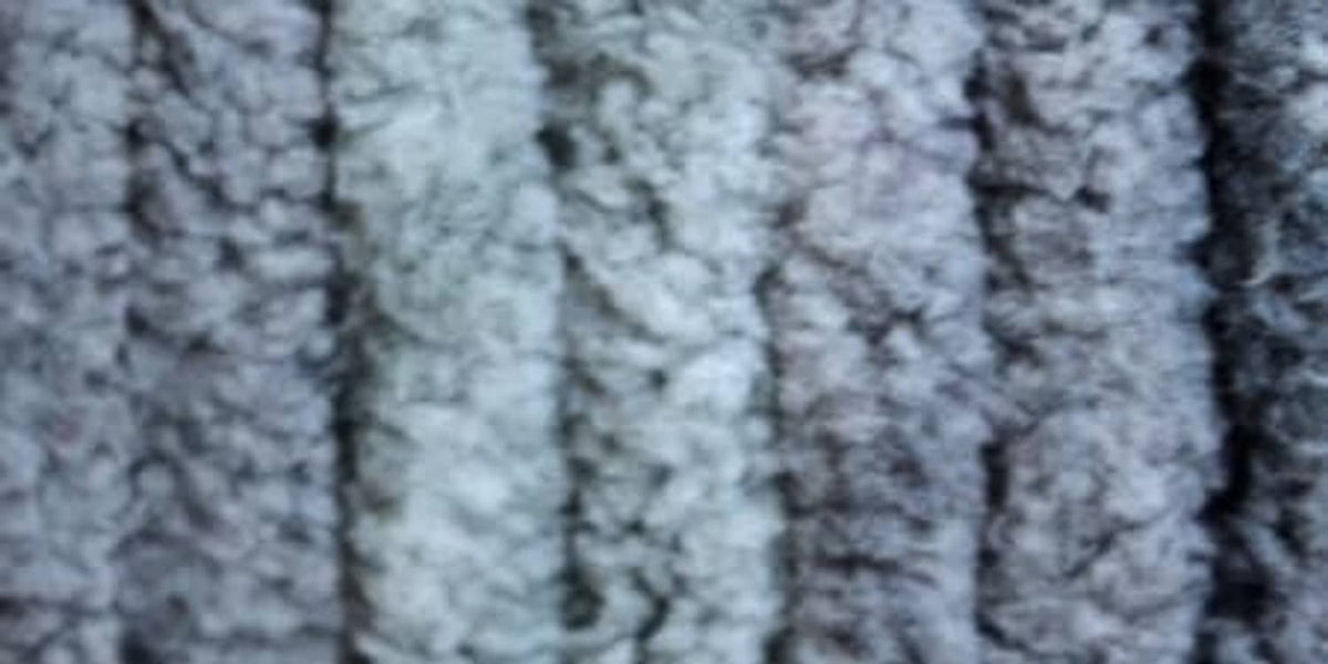 Thick textured yarn fabric close-up in cool gray-blue, soft chenille-style loops