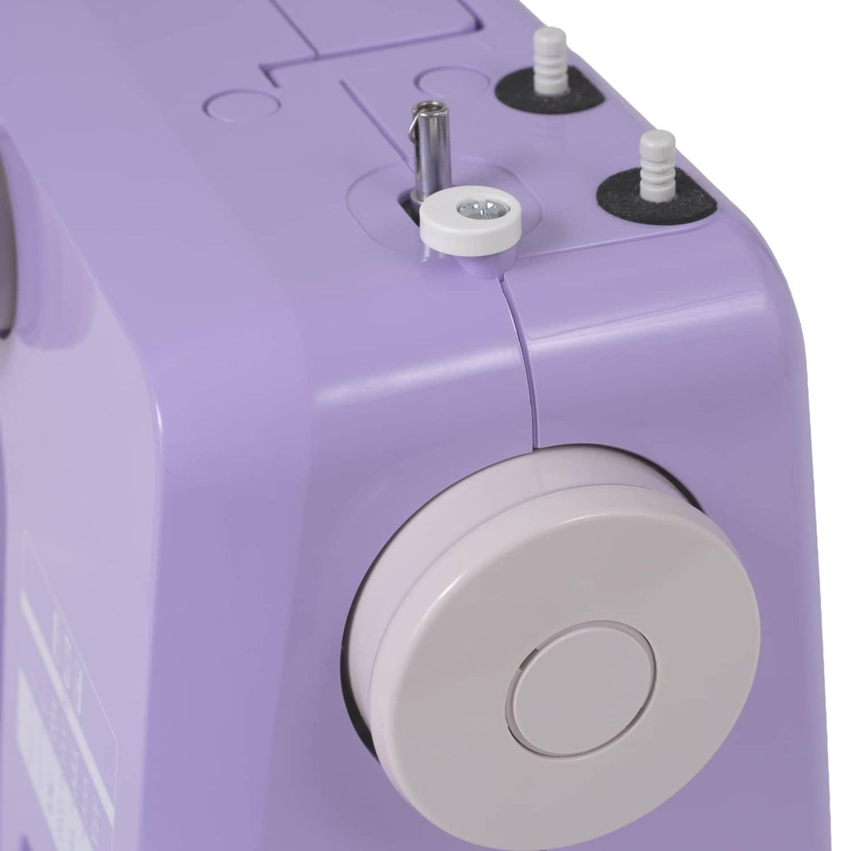 Close-up of purple Janome sewing machine handwheel with top posts