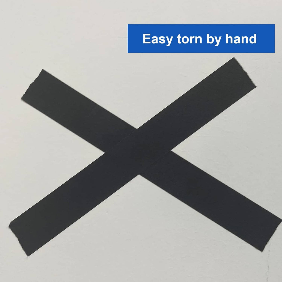 X-shaped black gaffer tape cross laid on a surface for securing items