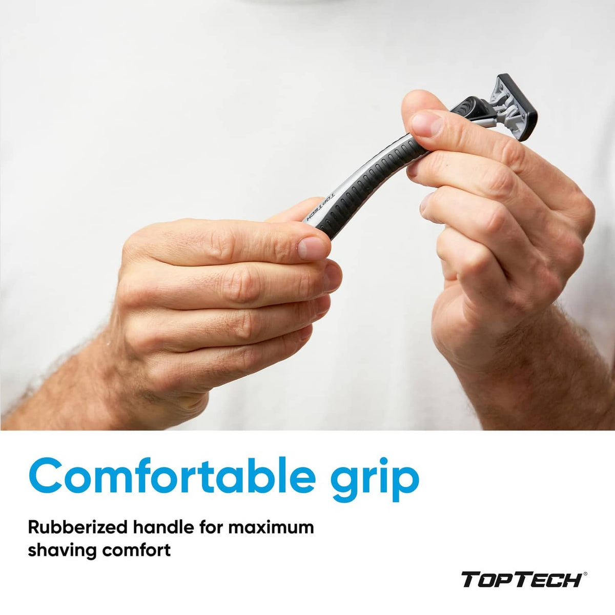 Men's razor handle held in hands, cartridge head pointed upward
