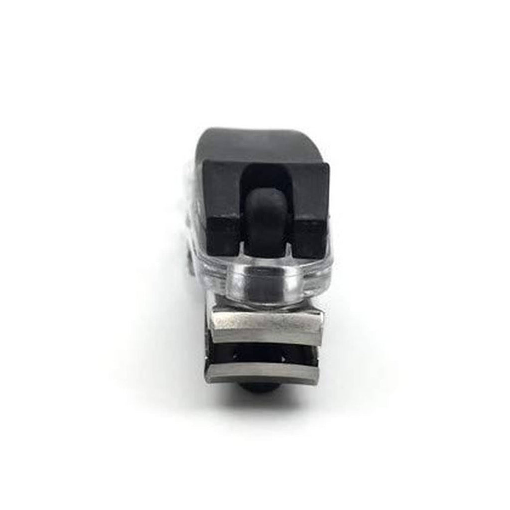 Nail clipper underside view with black cap and metal cutting edge