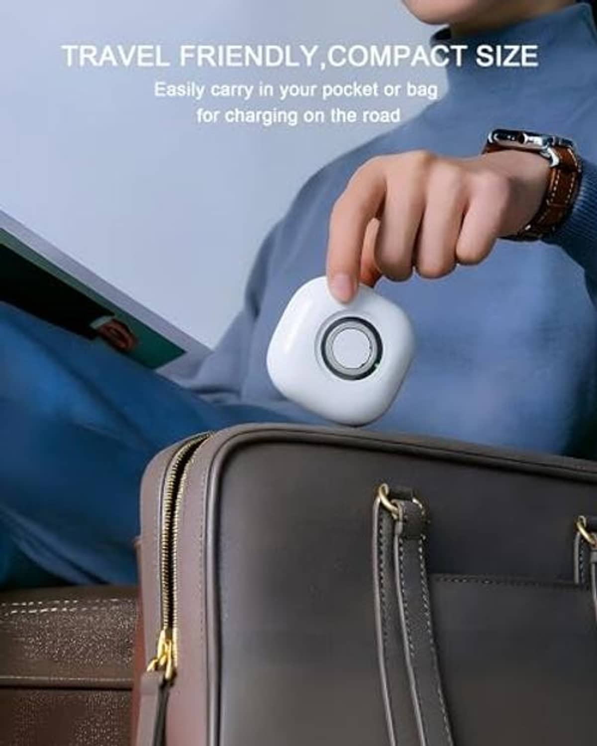 White compact charging case held in hand, circular button top, travel-friendly size