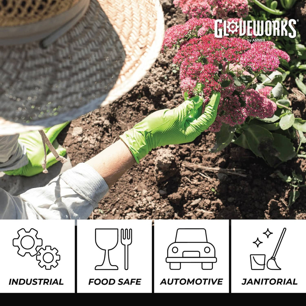 Green nitrile gloves with textured grip while gardening, pair in use