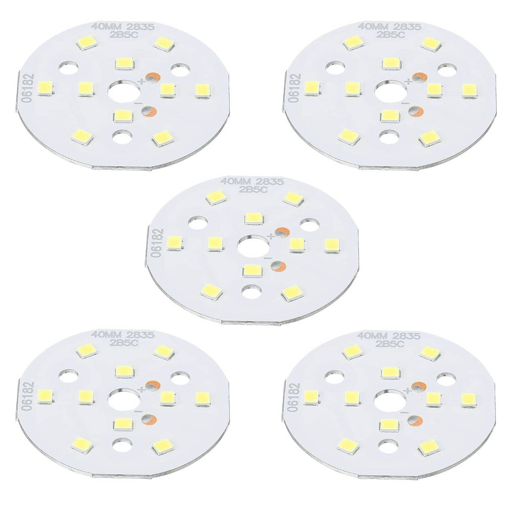 Round white LED chip board with multiple surface-mount LED squares and mounting holes