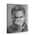 Black-and-white canvas wall art with portrait of man covering mouth, wrapped frame