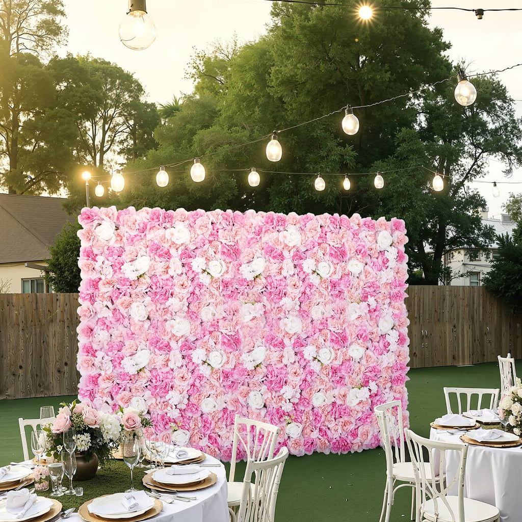 Artificial pink flower privacy wall panel with dense 3D petals and white bloom accents