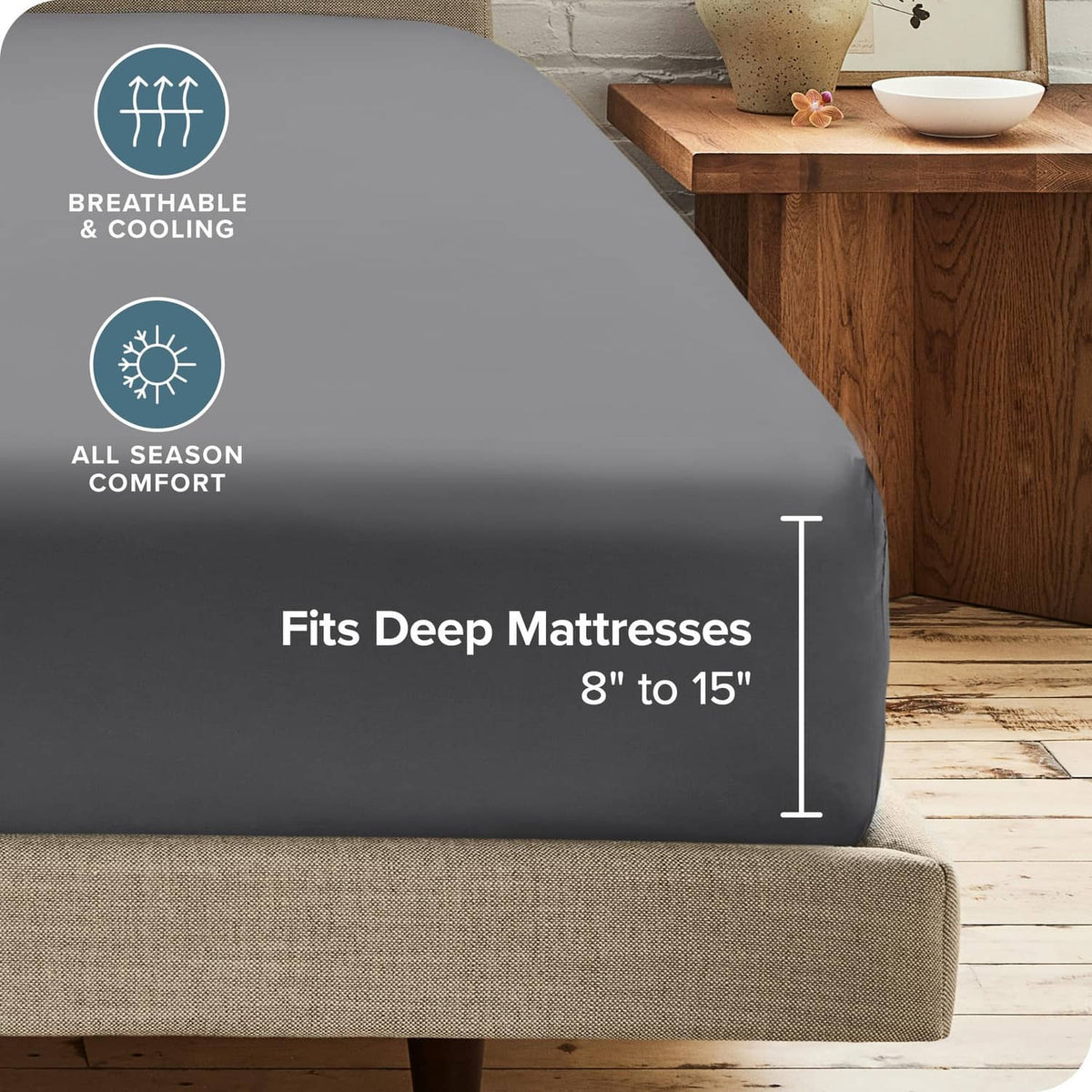Grey fitted sheet on mattress edge, deep pocket fit for 8–15 in