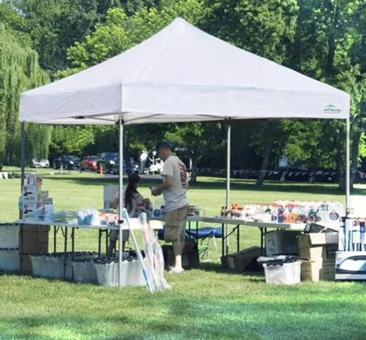 White pop-up tent canopy top with open sides and attached tie points