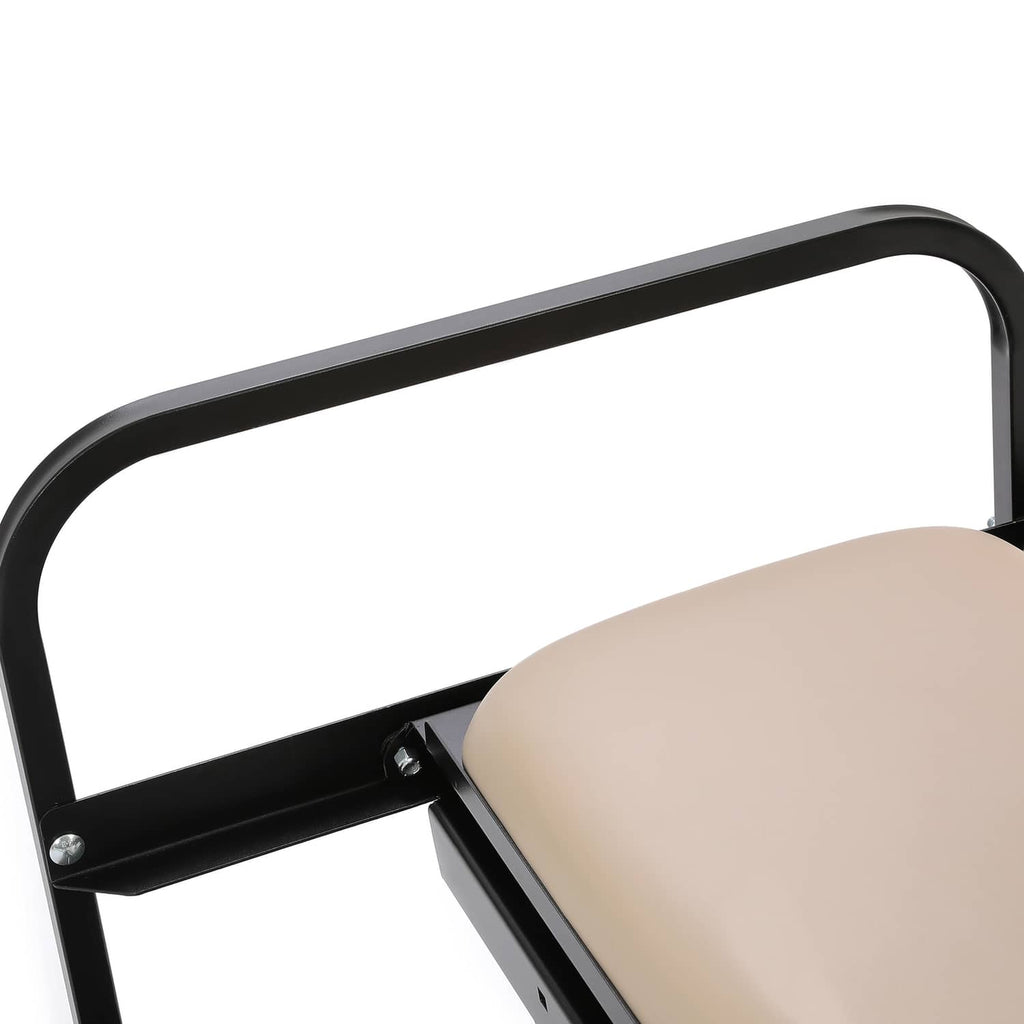 Close-up of tan backrest cushion over black support bar on folding seat frame