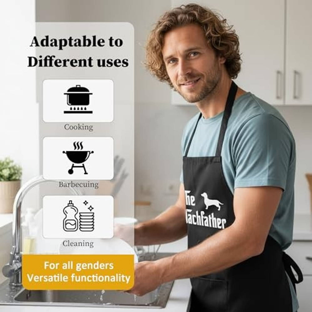 Black apron with Dachfather dog graphic worn by a man in a home kitchen.