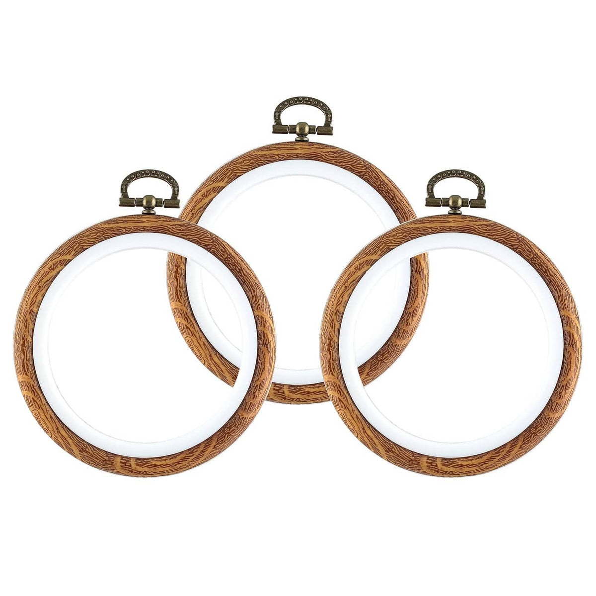 Three 4-inch embroidery hoops with brown faux wood frames and white inner rings
