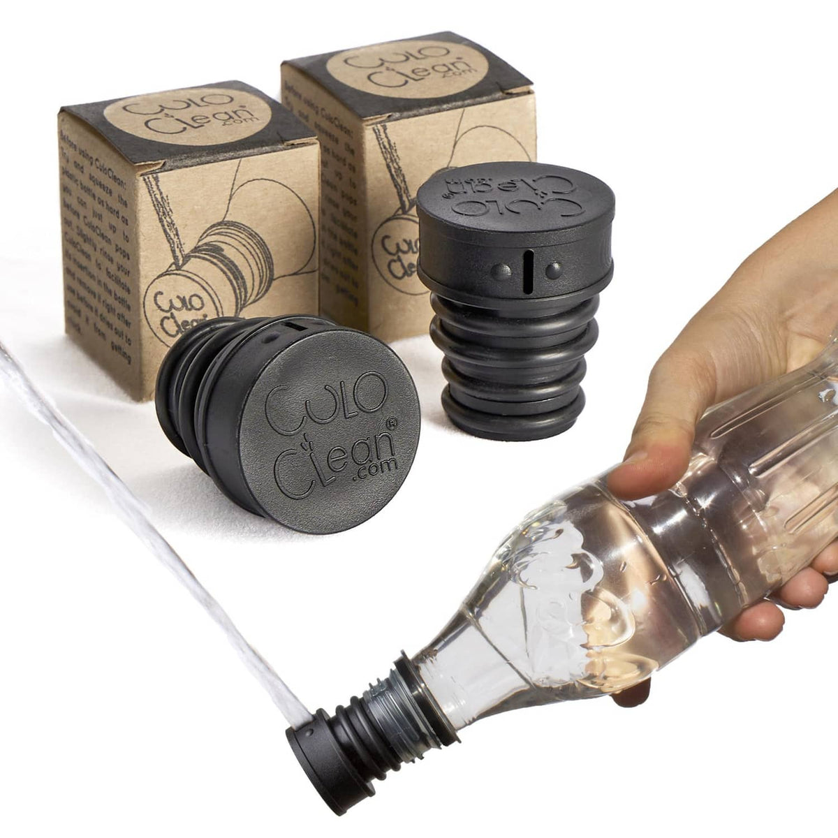 Black portable bidet set with two devices, caps, and clear squeeze bottle