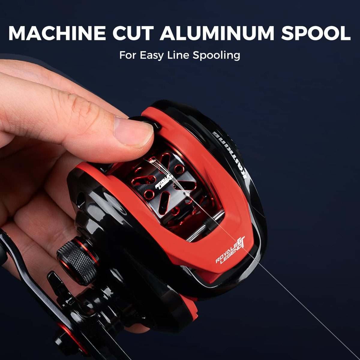 Hand-held view of black and red fishing reel spool with line-spooling mechanism.