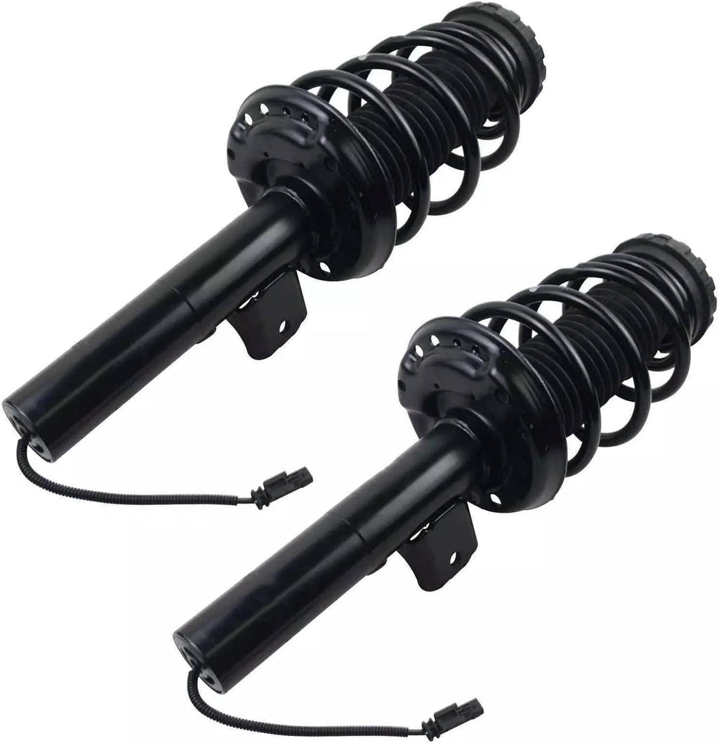 Two shock strut assemblies with black coil springs, dampers, and connected wiring