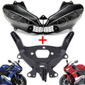 Black motorcycle headlight cowl with upper fairing stay bracket and mounting hardware