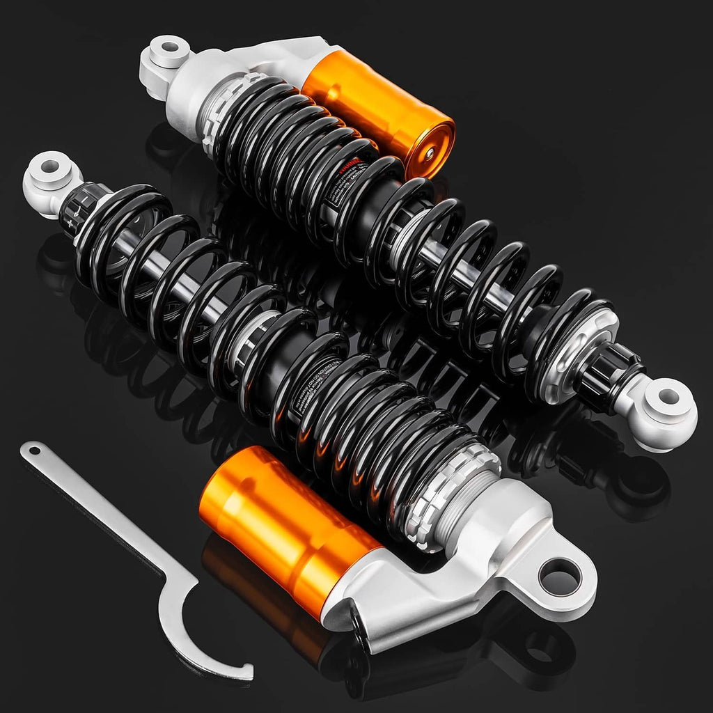 Adjustable air shock absorbers with orange reservoirs, black springs, and silver mounts