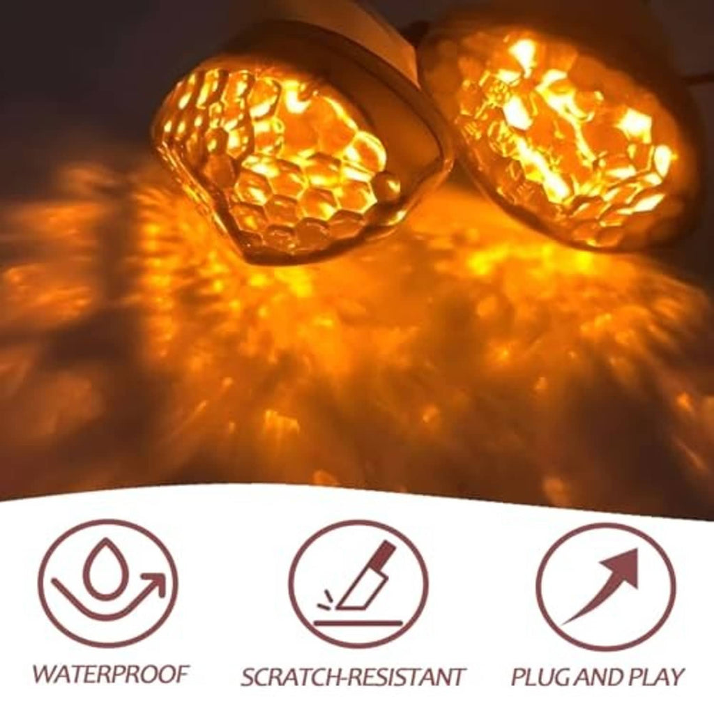Lit amber LED turn signal lenses in black housings