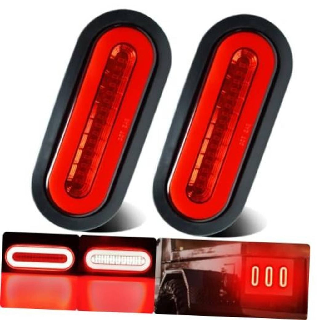 Pair of oval red LED trailer lights with black housing and clear lens