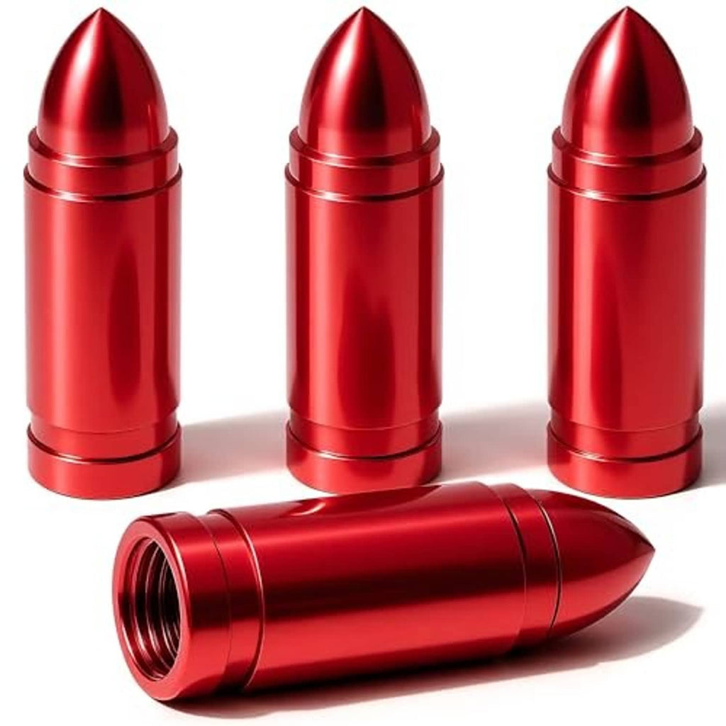 Red bullet-style tire valve stem caps with conical tops, three upright and one lying