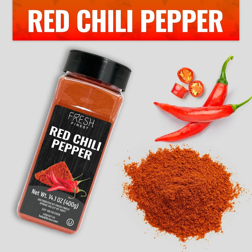 Red chili pepper seasoning jar with pile of red chili powder and peppers