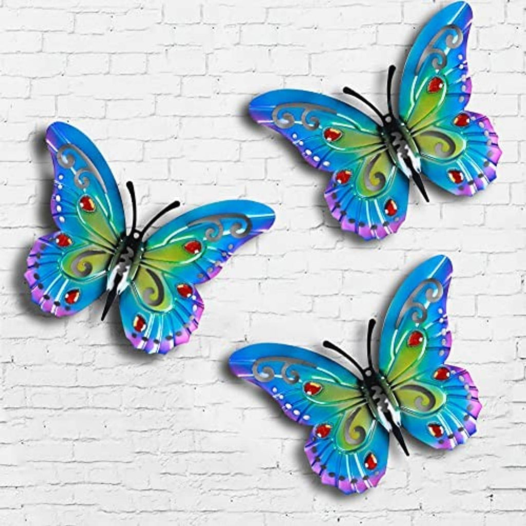 Set of four colorful metal butterflies with blue-green wings and red jewel details
