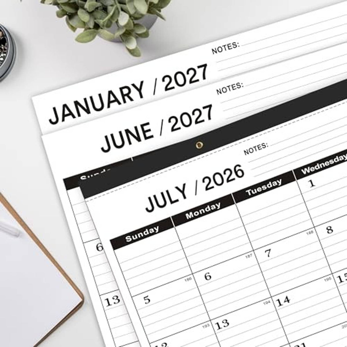 Stacked desk calendar pages showing January 2027, June 2027, and July 2026 sections