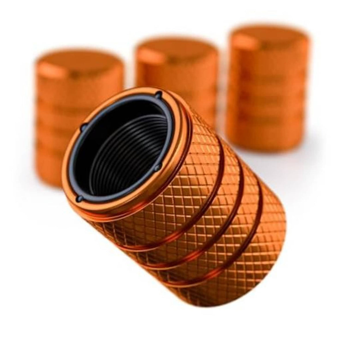 Amber orange aluminum tire valve stem cap set with black rubber insert and knurled grip