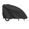 Black log splitter cover with zippered edge and tie-down straps, fitted over the unit