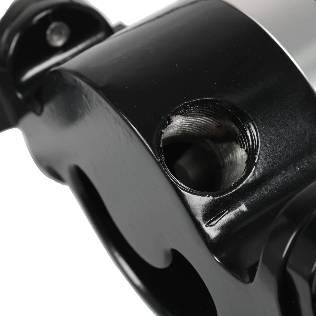Electric water pump fitting close-up with threaded opening and black housing
