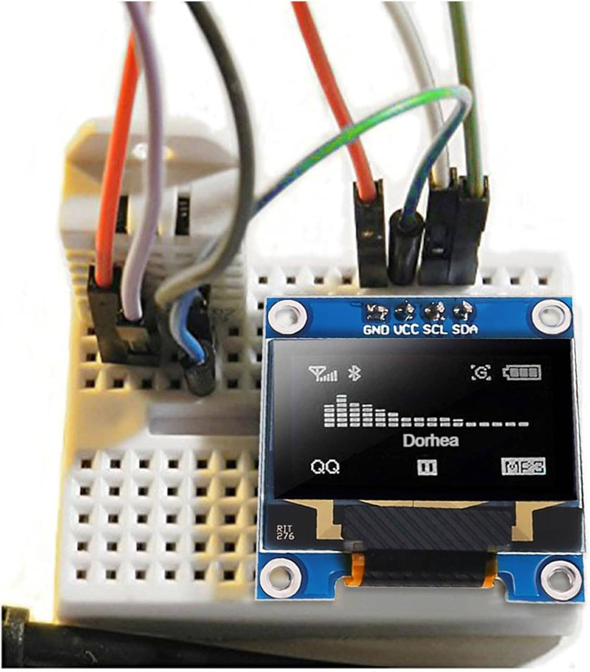 OLED SSD1306 module on breadboard with jumper wires, blue PCB and black display.