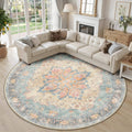 Round washable area rug with ornate medallion pattern in blue, orange, and red