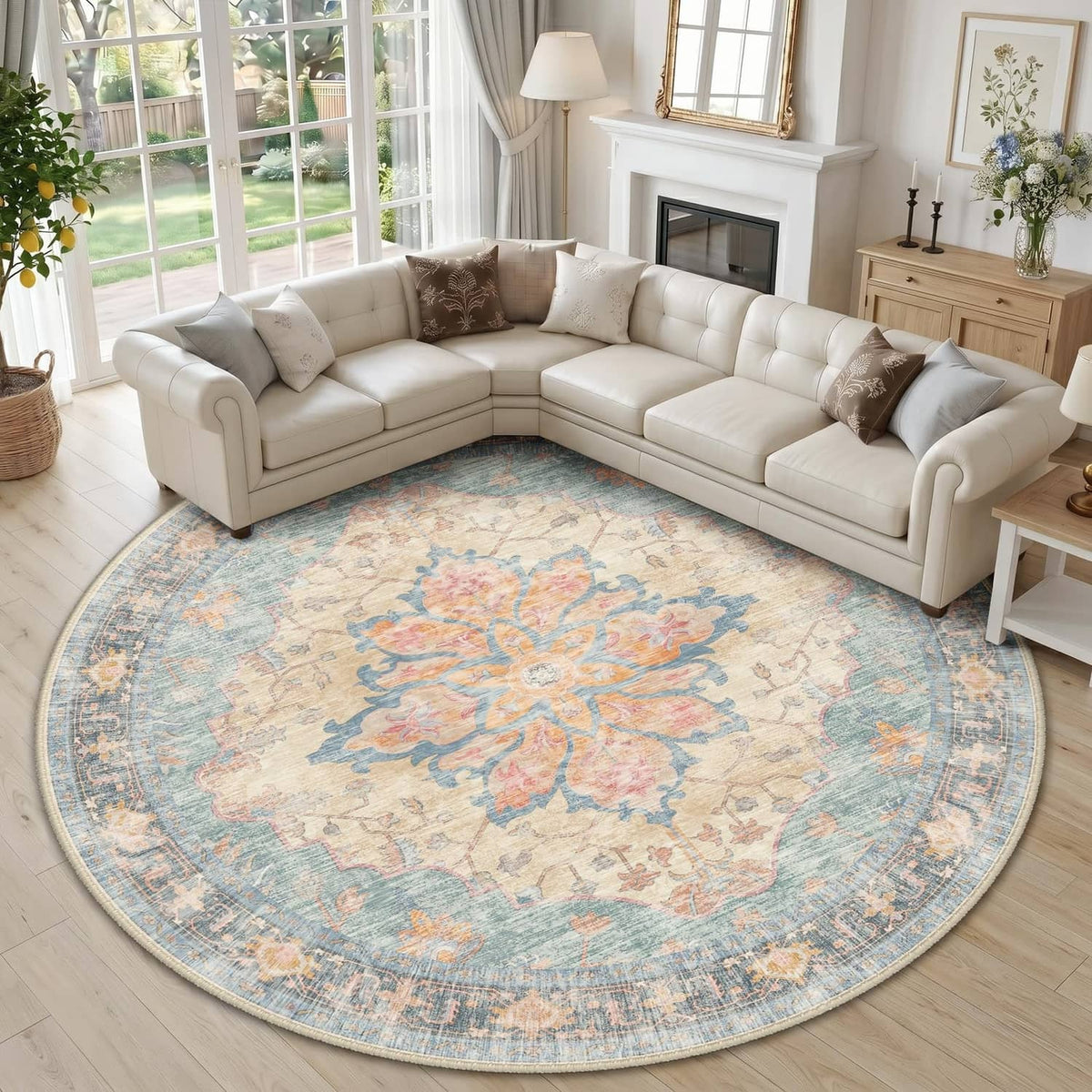 Round washable area rug with ornate medallion pattern in blue, orange, and red