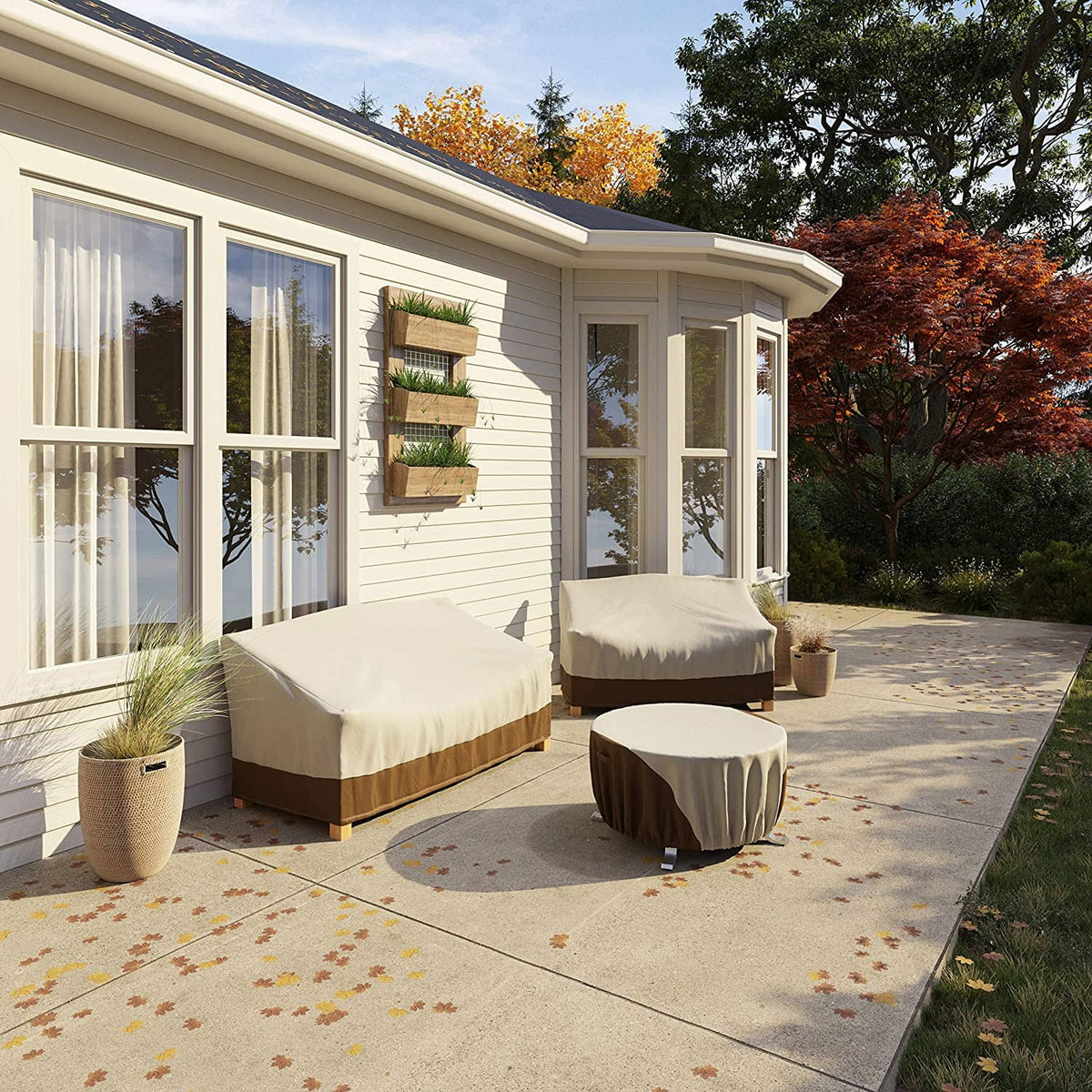 Outdoor patio furniture couch covers, cream tops with brown base and protective fit.