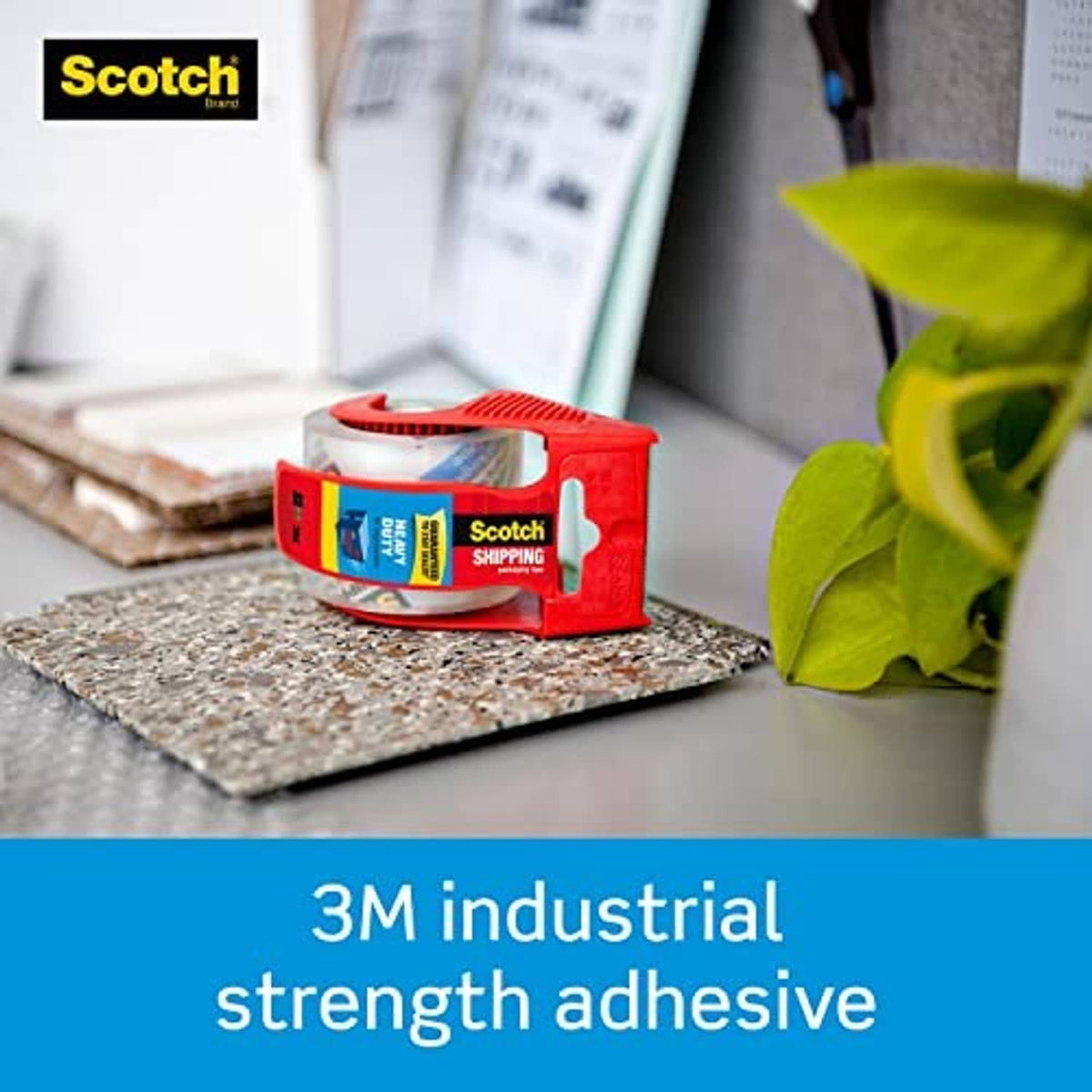 Scotch heavy-duty packaging tape dispenser with red handle and clear tape roll