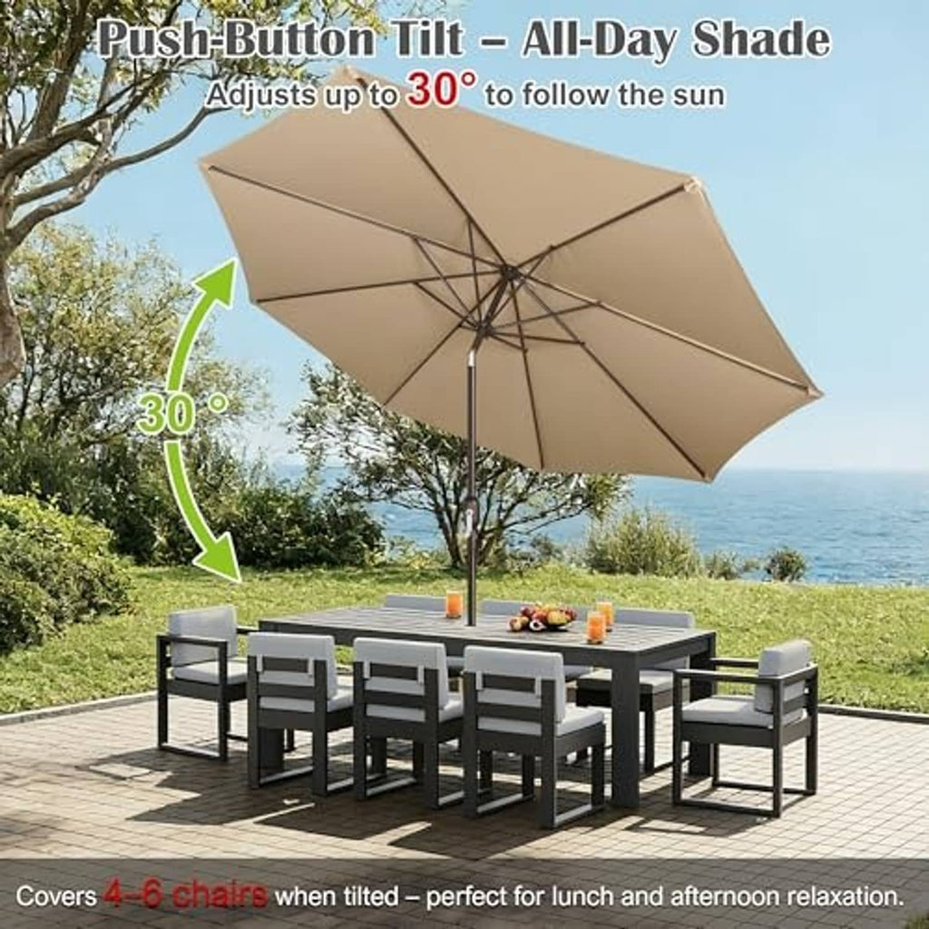 Market tan patio umbrella with tilted open canopy over outdoor table set