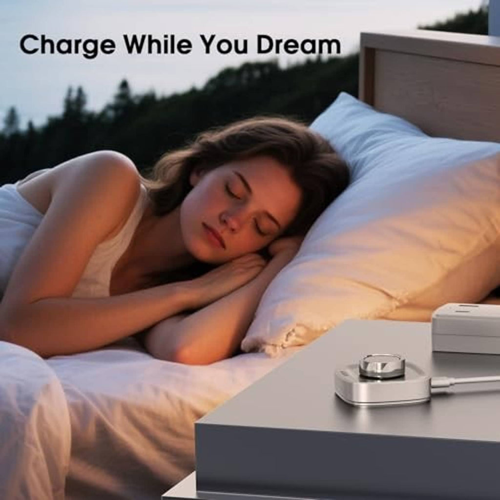 Oura Ring Gen 4 charging dock on bedside surface, silver base with blue status light