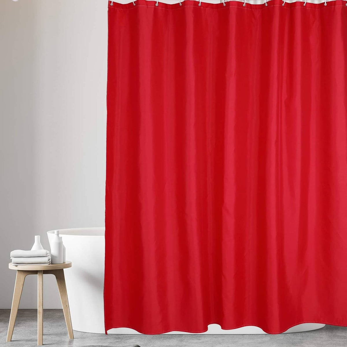 Red shower curtain liner with wide pleats and evenly finished bottom hem