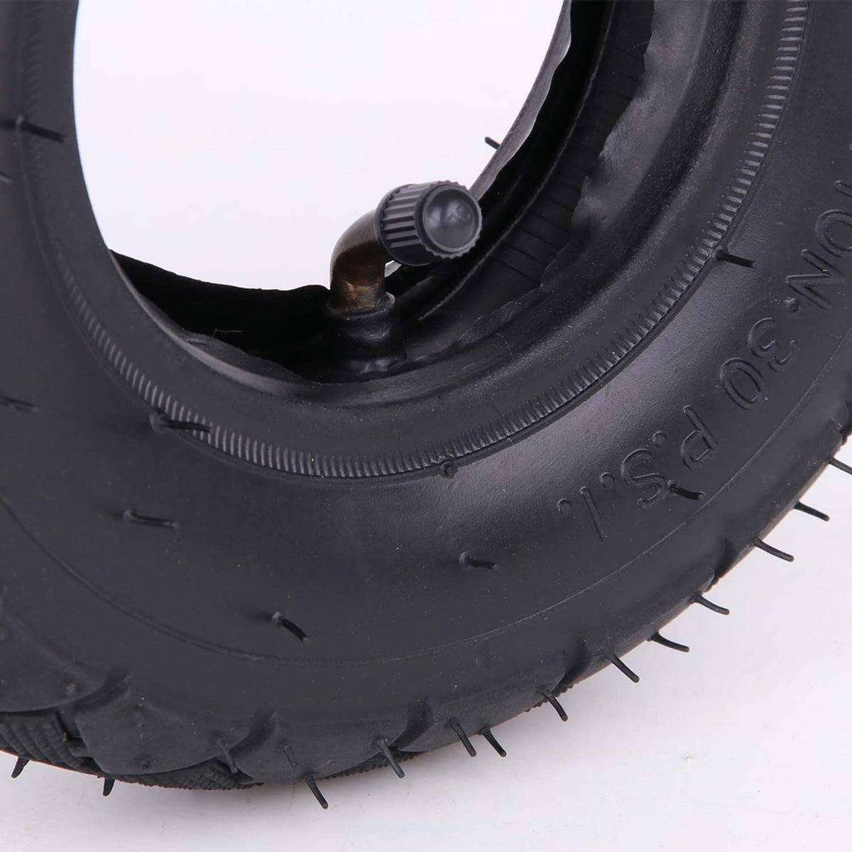 Tire with inner tube valve and thick sidewall, close-up of valve stem