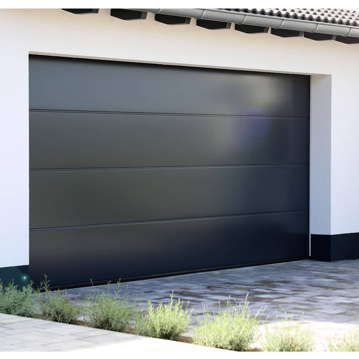 Closed dark garage door with track and header area