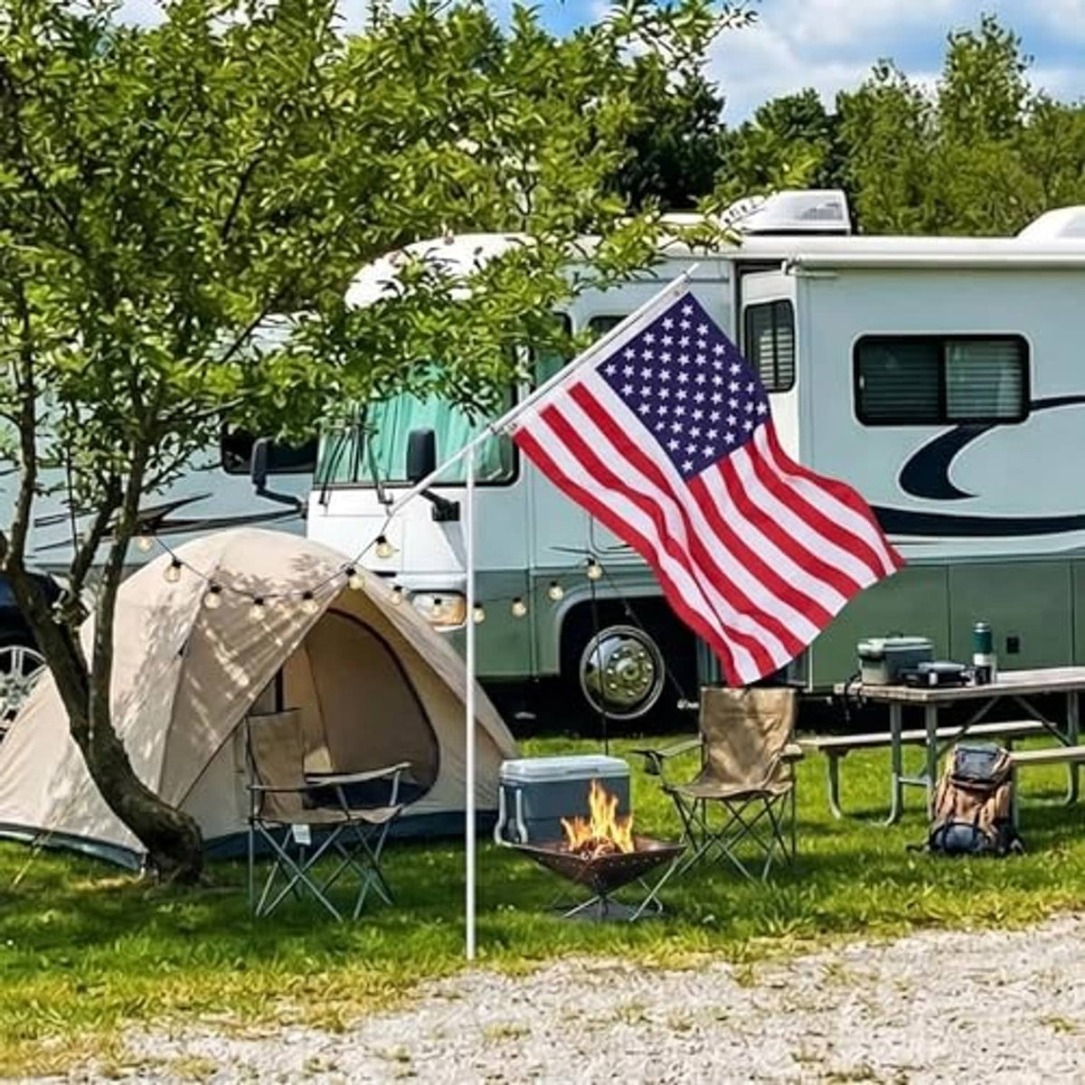 American flag on a white telescoping pole with ground stake, displayed outdoors