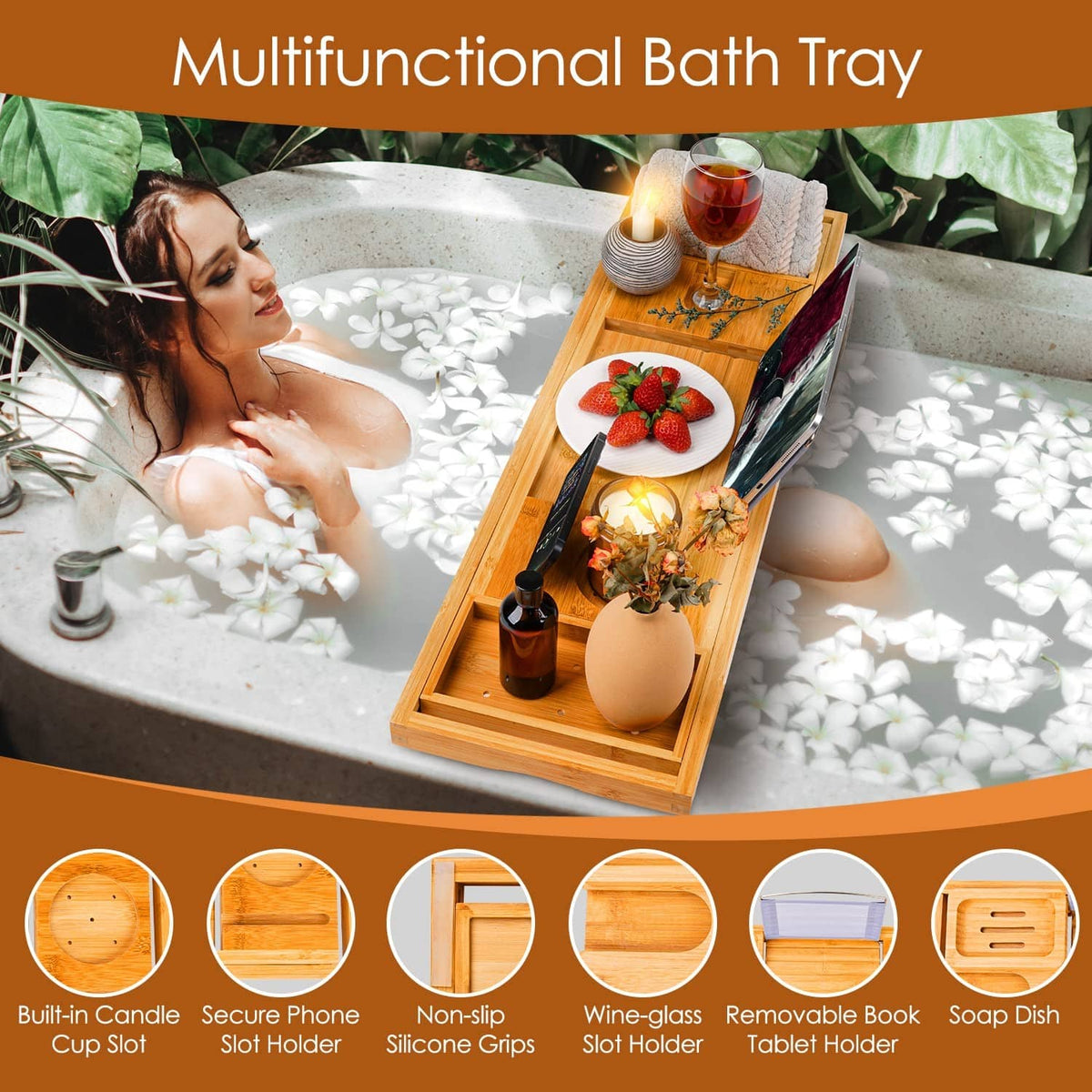 Beige bamboo bath caddy tray on a bathtub ledge with wine glass and candle