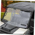 Front UTV windshield with dark frame and clear tinted panel, installed on vehicle