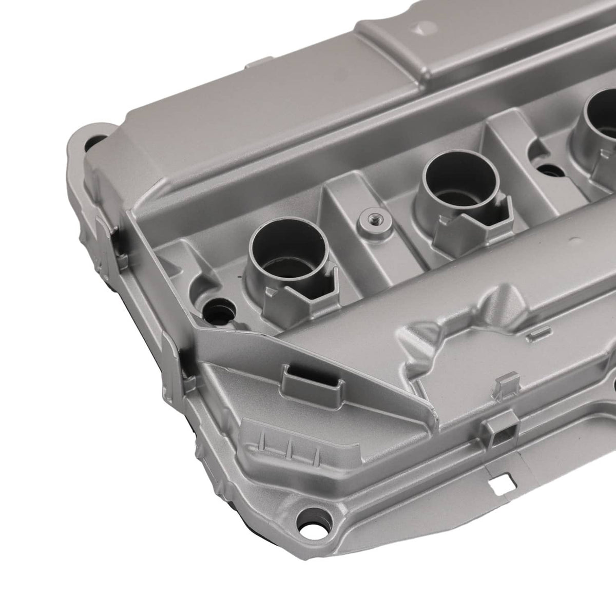 Silver aluminum valve cover housing with internal channels and port openings