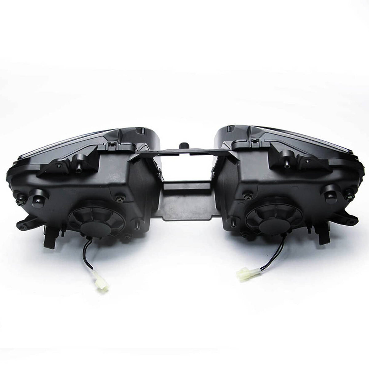 Black headlight assembly with clear lens covers, center frame, and wire connectors