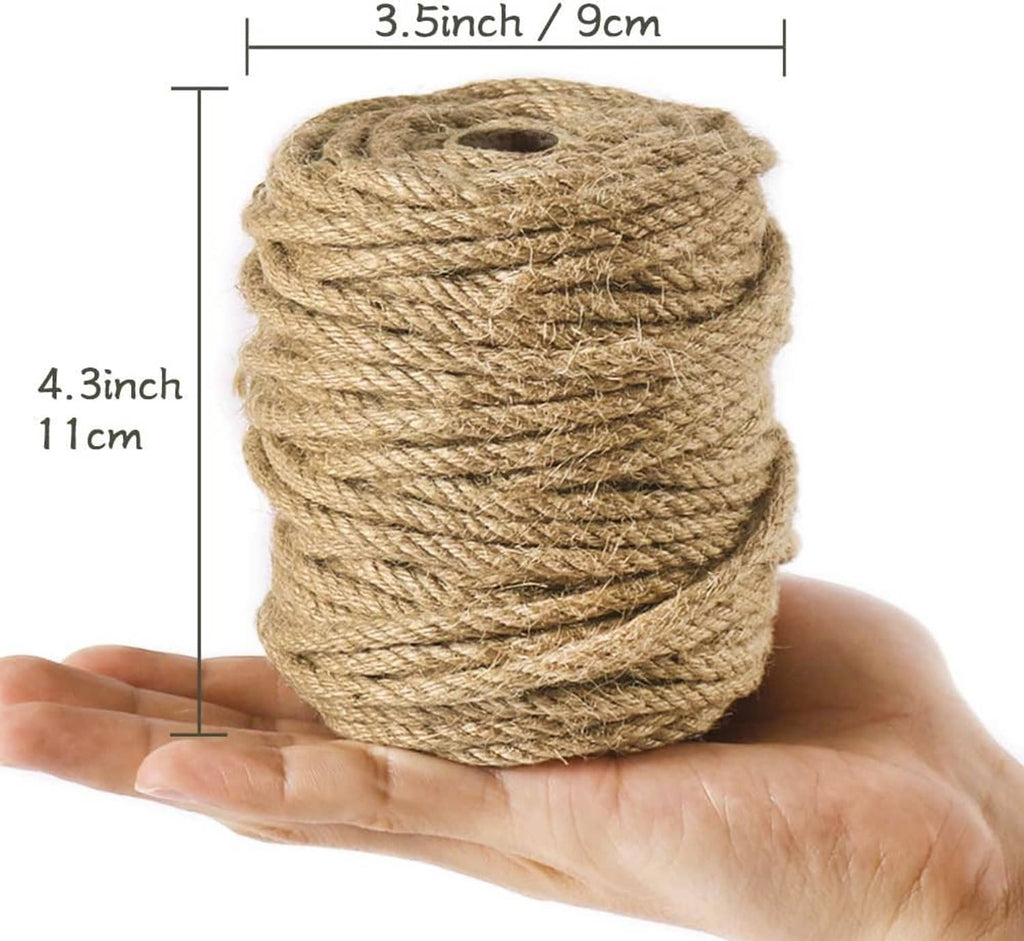 Thick twisted jute rope bundle held in hand, natural beige-brown color.