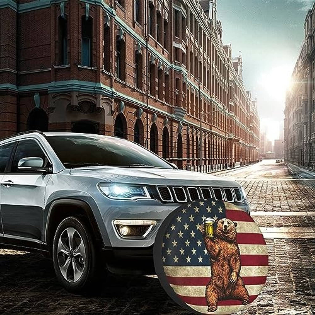 Spare tire cover on SUV wheel with bear and American flag circular design