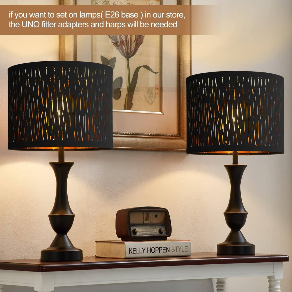 Black drum lampshade pair with gold streak pattern and matching open-top shade shape